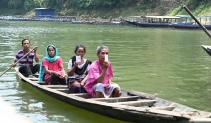 Voters Arrive Via Boat To Cast Votes