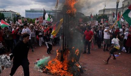 Netanyahu in Congress, protestors burn US flag outside