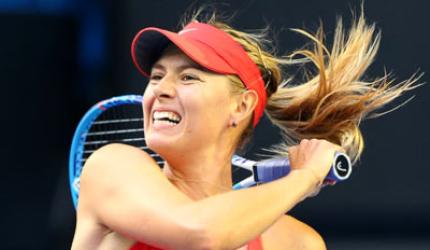 Sharp Sharapova returns to form to reach fourth round