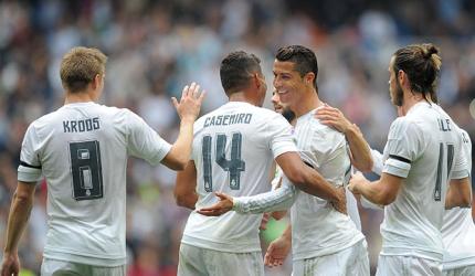 Record Ronaldo goal helps put Real Madrid top of La Liga