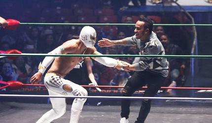 What fun! F1 champion Hamilton wrestles with Mexican culture