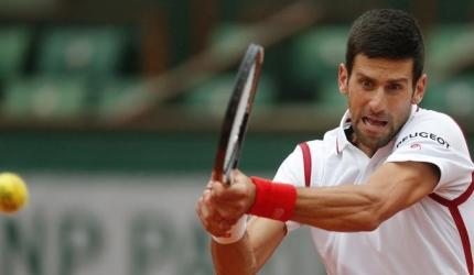 French Open PIX: Djoko back on top before rain stops play, Radwanska exits