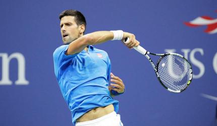 PHOTOS: Djokovic shakes off rust, to face Tsonga in quarters