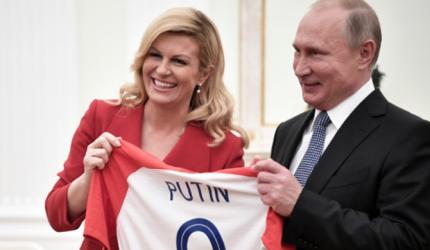 Croatian leader hands Putin soccer shirt before World Cup final