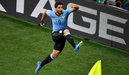 World Cup: Vintage Suarez on the spot as Uruguay go through