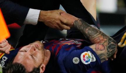 PHOTOS: Messi injury blow as Barca go top with win over Sevilla