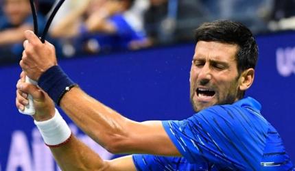 US Open PICS: Djokovic, Federer through; Venus exits