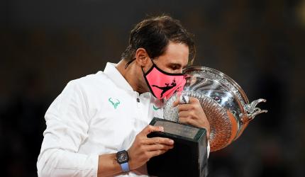 Nadal continues Paris reign with record-equalling Slam