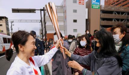 Olympic torch staffer is event's 1st COVID infection