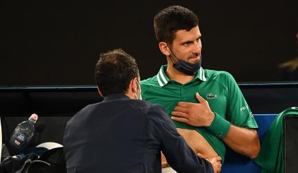 Injured Djokovic skips practice, awaits scans result