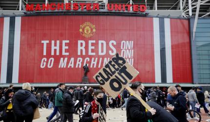 Man United-Liverpool tie postponed as fans storm pitch