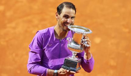 Nadal overcomes blip to down Djokovic in final