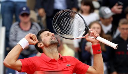 Djokovic keeps title defence on track, Zverev survives