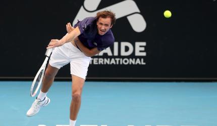 Medvedev reaches quarters; Sabalenka survives scare