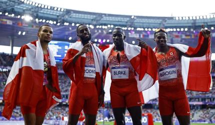 PIX: Canada win 4x100 as US blow it; Chebet double