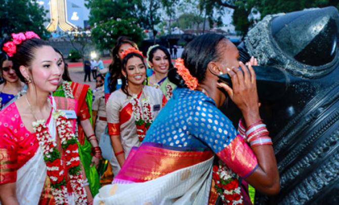 What Is She Whispering Into Nandi's Ear?