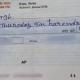 Teacher who issued cheque with spelling errors suspended