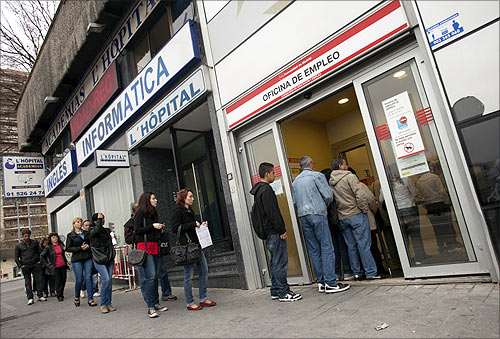 People enter a government employment office in Madrid.