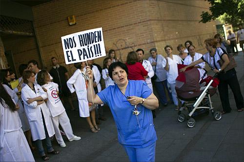 Public health workers take part in a protest.