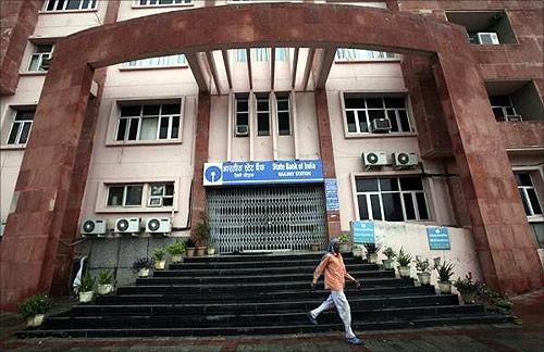 A man walks down the stairs of a bank during a two-day strike in Jammu.