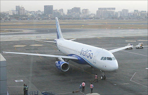 An IndiGo Airlines aircraft arrives at a gate of the domestic airport in Mumbai.