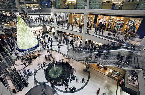 People go shopping in a mall in downtown Toronto.