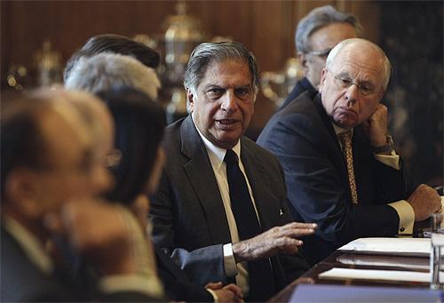 Chairman of Tata Sons Ratan Tata (C) speaks during a