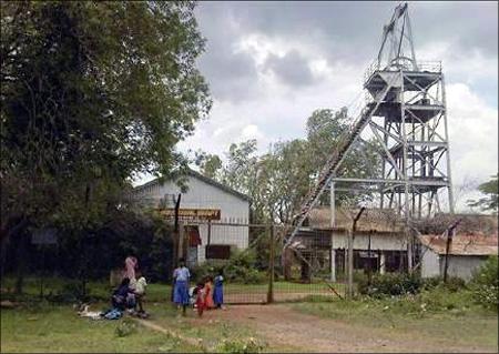 Schoolchildren play in front of an abandoned shaft at Kolar Gold Fields, located in Karnataka.