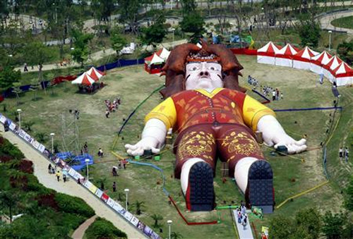 People visit a giant replica of Lemuel Gulliver built in a park in central Taiwan's city of Taichung.