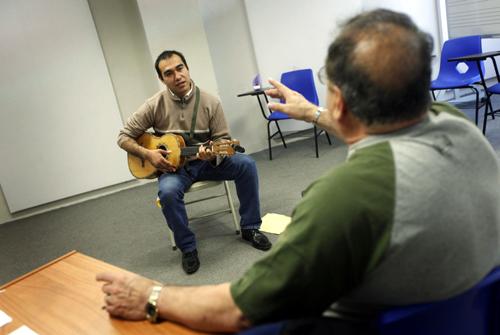 An applicant plays the vihuela in front of a teacher during a selection process for entry into the school of Maricahi Ollin Yoliztli in Mexico City.