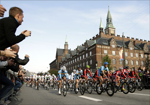 The pack of riders start the men's road race elite event at the UCI World cycling championships in front of the City Hall in Copenhagen.
