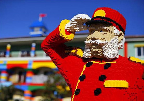 One of hundreds of Lego figures is seen by a pool as construction continues.
