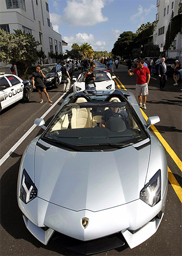 A Lamborghini Aventador LP 700-4 Roadster waits for a parade to begin before a high-speed demonstration to mark the automaker's 50th anniversary.