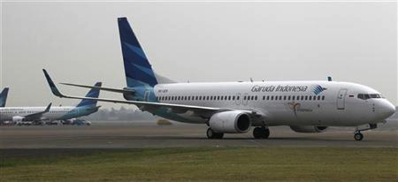 A Garuda Indonesia Boeing 737-800 airplane taxis on the tarmac at Soekarno-Hatta Airport in Tangerang in outskirt of Jakarta. 