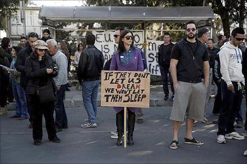 Protesters take part in an anti-bailout rally outside the parliament in Nicosia.