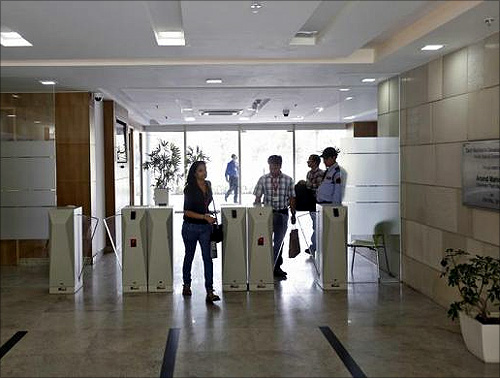 Employees arrive for work at Tech Mahindra office building in Noida on the outskirts of New Delhi. 
