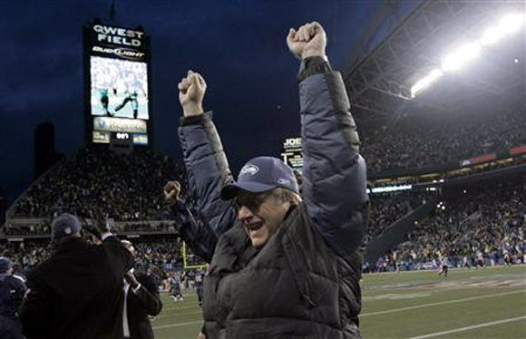 Seattle Seahawks owner Paul Allen celebrates a touchdown against the Washington Redskins in their NFC Wild Card NFL playoff football game in Seattle, Washington in this January 5, 2008 file photo.