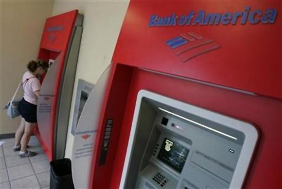 A woman uses an automated teller machine at a Bank of America branch in Chicago.