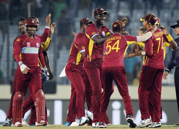 West Indies players celebrate after winning the game