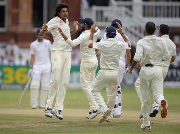 Ishant Sharma of India celebrates dismissing England captain Alastair Cook 