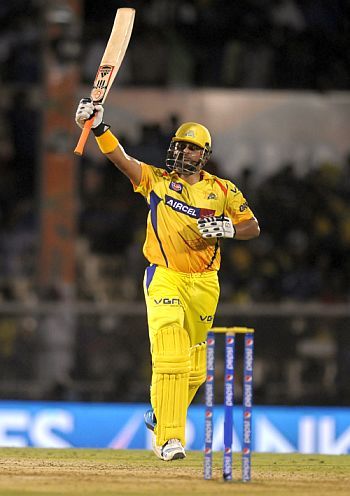Suresh Raina celebrates after getting to 50