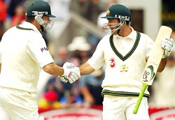 Ponting is congratulated by Steve Waugh after his century