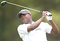 West Indies cricket captain Brian Lara tees off during the Cotton Tree Foundation charity golf tournament at St Andrew's golf course, near Port-of-Spain, Trinidad, April 21, 2004. The cricketers were taking a training break during the One Day Series which England lead 1-0.
