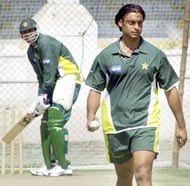 Shoaib Akhtar prepares to deliver a ball to Inzamam-ul Haq during a net practice session
