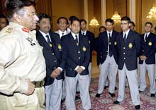 Pakistani President Pervez Musharraf (L) chats with members of the touring Indian cricket team during a meeting in Islamabad