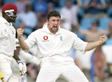 England's Stephen Harmison (R) celebrates after West Indies Captain Brian Lara was LBW