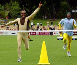 New Zealand's Mark Richardson (left) celebrates as he crosses the finish line to defeat Australia's Darren Lehmann during a charity race after the second Test