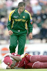 West Indies' Brian Lara lies on the ground after being hit by a ball by Pakistan's Shoaib Akhtar