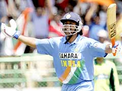 Dhoni celebrates after reaching his century in the second ODI against Pakistan