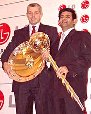 ICC General Manager (cricket) Dave Richardson (left) and Salil Kapoor, Head of Marketing - LG Electronics with the ICC Test and ODI championship trophies in Mumbai